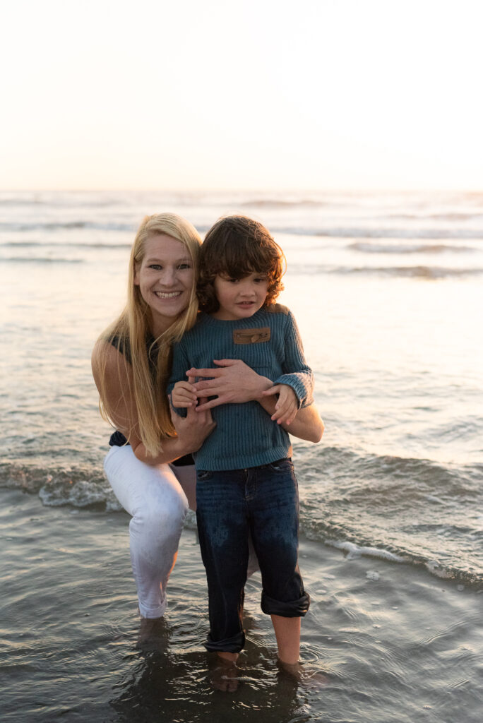 Mom and son in the surf in Oceanside, CA