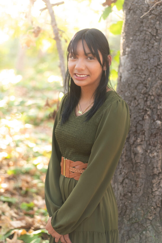 A teenage girl poses during a family session in Fallbrook, CA