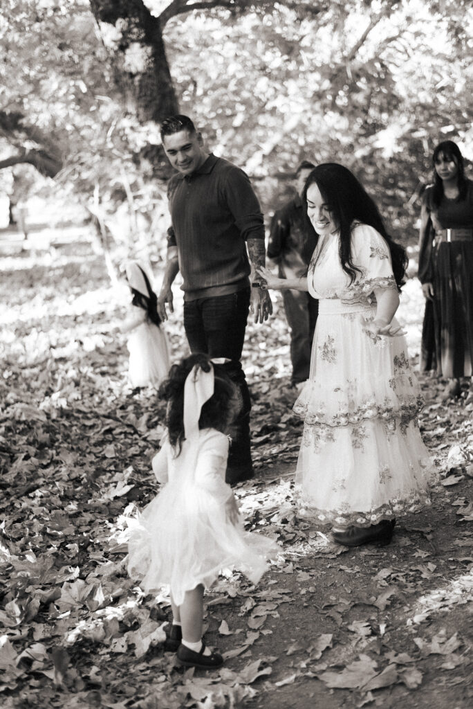 A mom dances with her young daughter during a family session in Fallbrook, CA