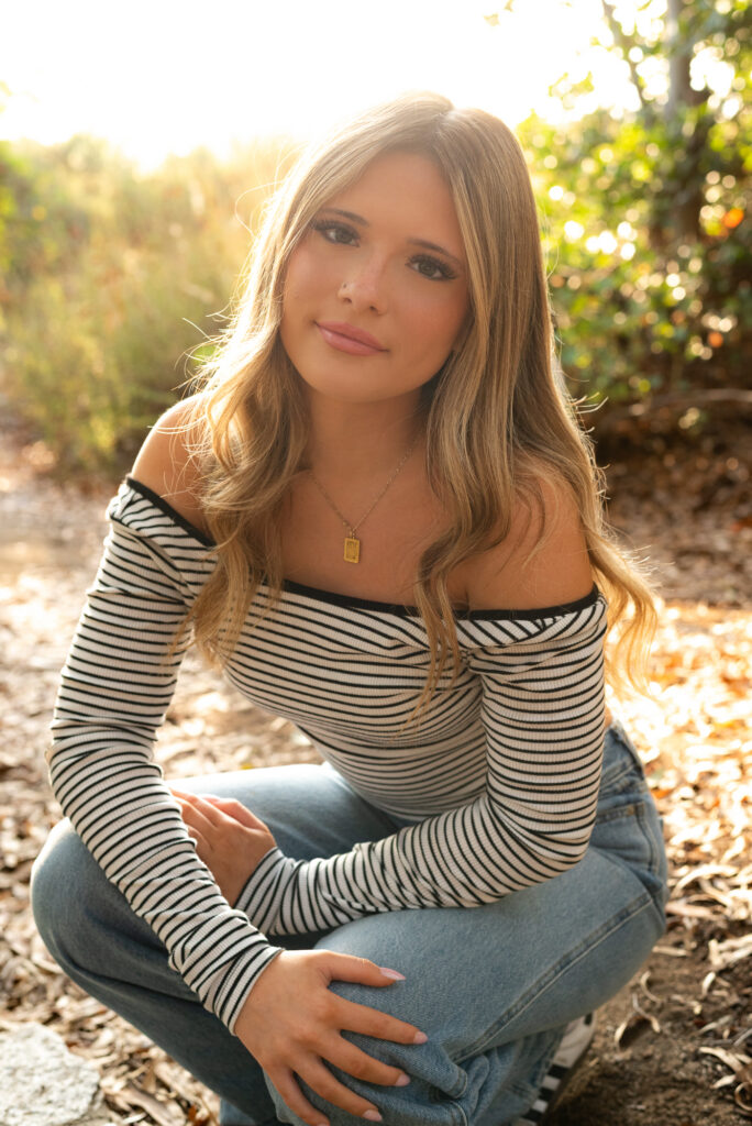 High school senior posing in a natural California landscape during senior portraits